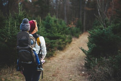 mom-and-baby-hiking-in-the-woods