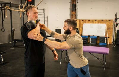 physical-therapist-correcting-an-exercise